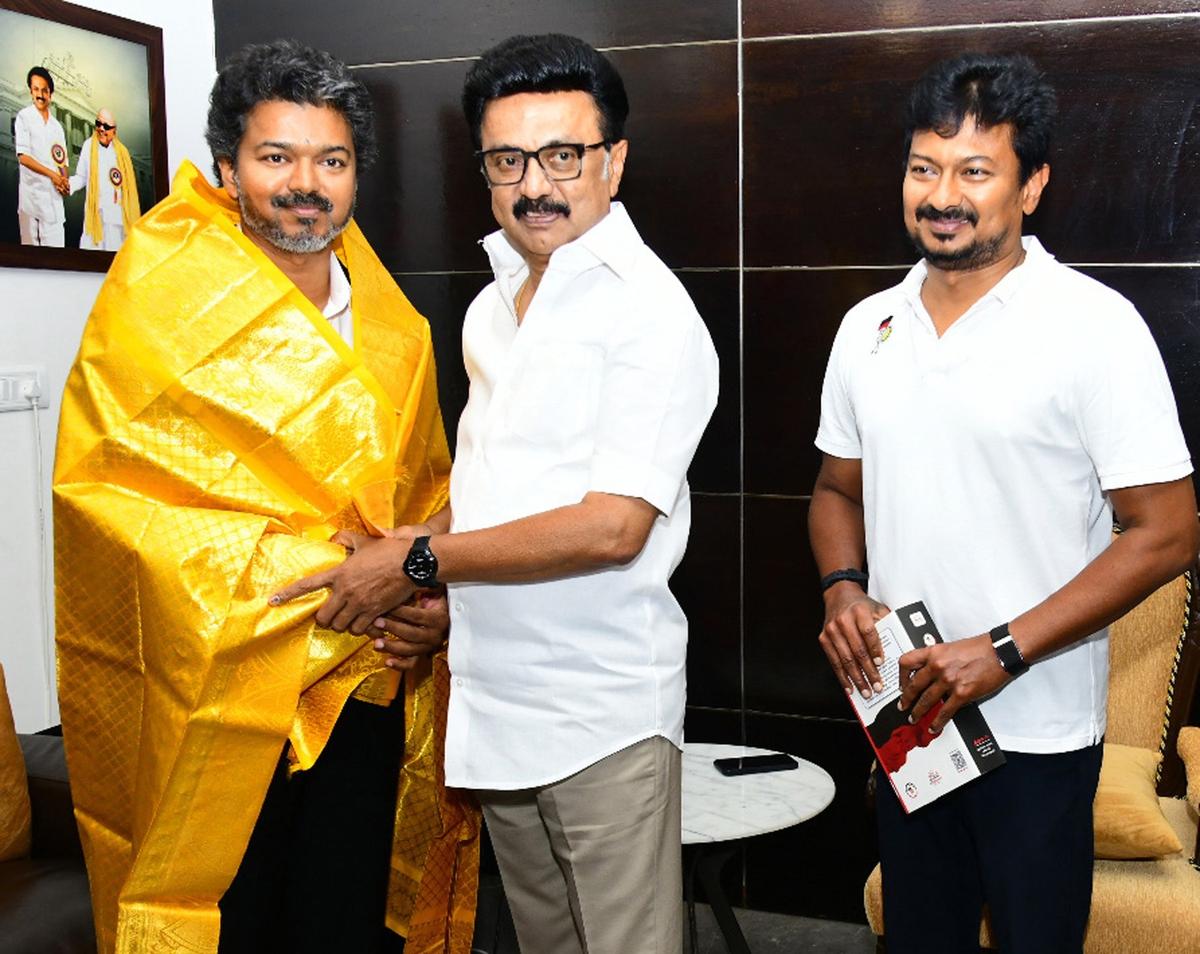 Former Chief Minister MK Stalin hands over a shawl to Chief Minister C. Joseph Vijay, in the presence of opposition leader Udhayanidhi Stalin on May 11, 2026.
