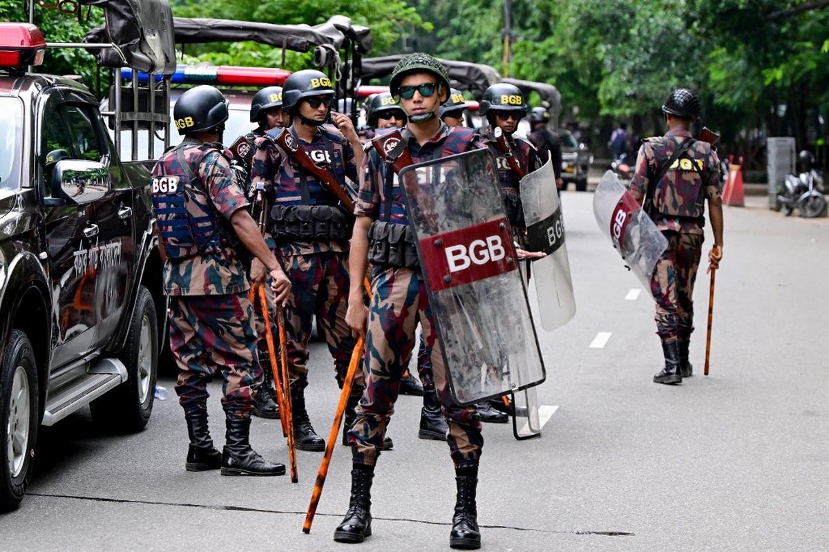 Border Guard Bangladesh (BGB) personnel stand guard at Dhaka University in the capital on July 17, 2024, as student protests against quotas in government jobs turned violent. 