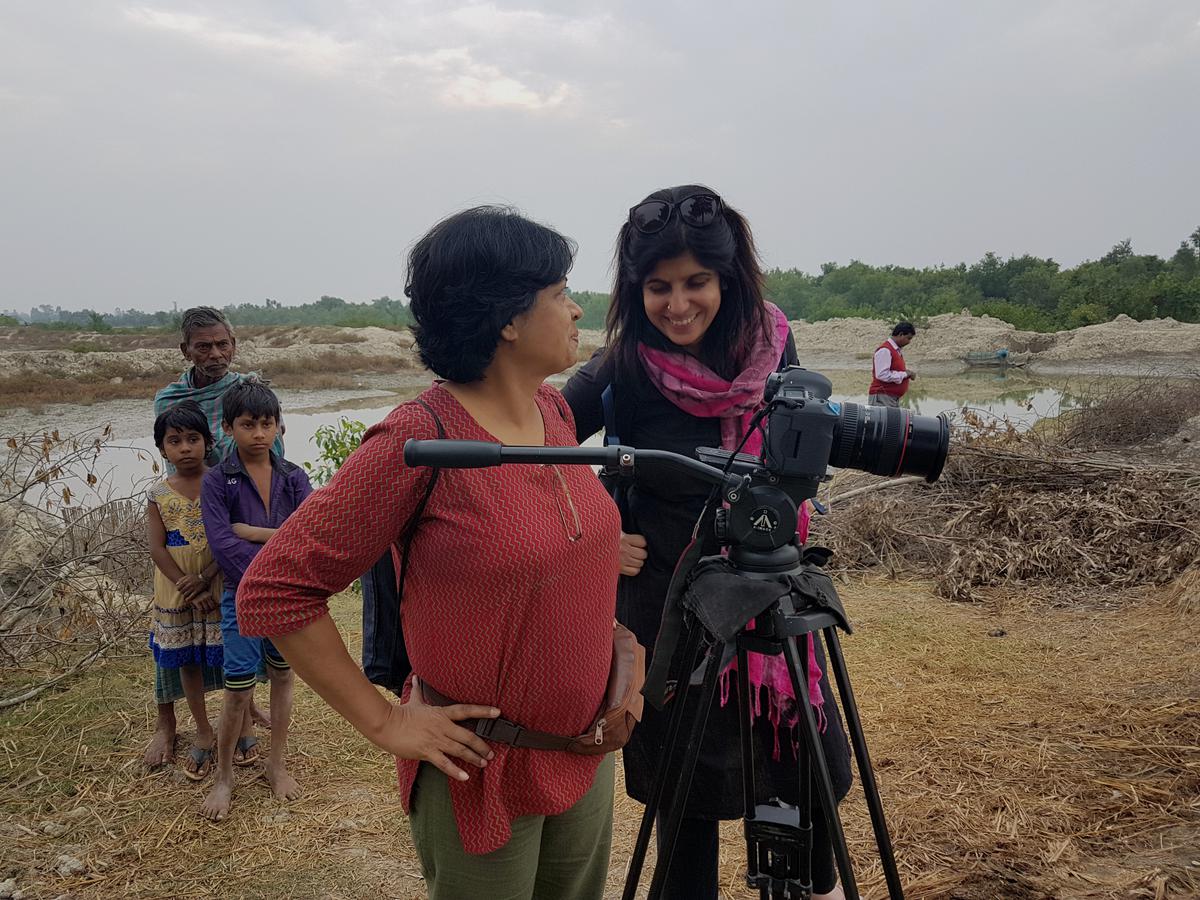 Miriam with a crew member during the shooting of From the Shadows