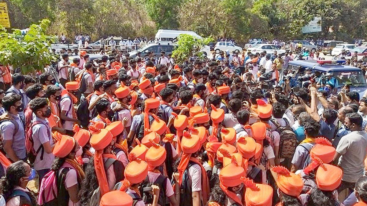 Karnataka High Court restrains students from wearing saffron shawls, scarves, hijab, religious flags in classrooms for now