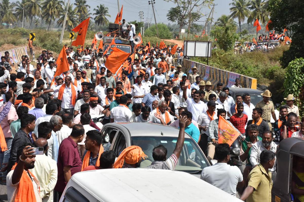 Members of various pro-Hindu outfits participate in a padyatra on January 29, 2024, a day after a saffron-colored flag on a 108-feet flagpole on a government ground at Keragodu in Mandya district is was replaced with the tricolor. 