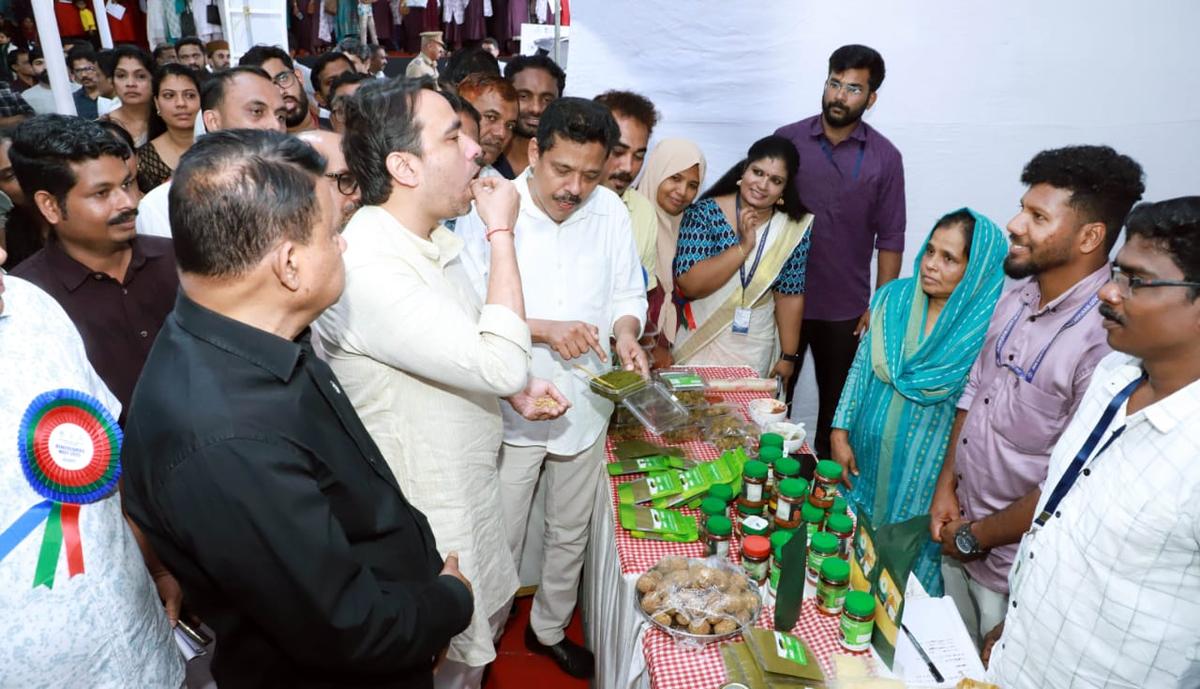 Union Minister of Skill Development and Entrepreneurship Jayant Chaudhary tasting tribal products during an exhibition organised by the JSS in Malappuram on July 17.
