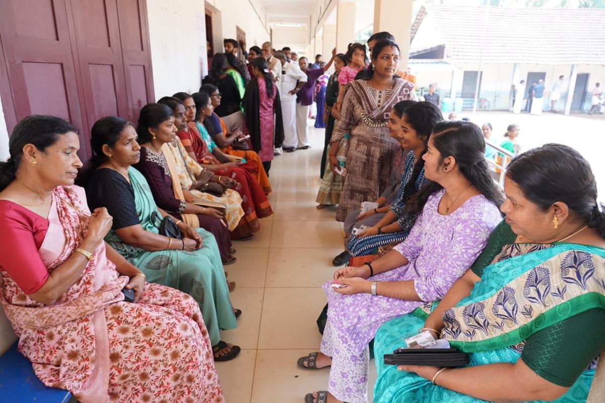 Voters waiting outside a polling station at GLP School, Pariyapuram, Tanur, on Thursday.