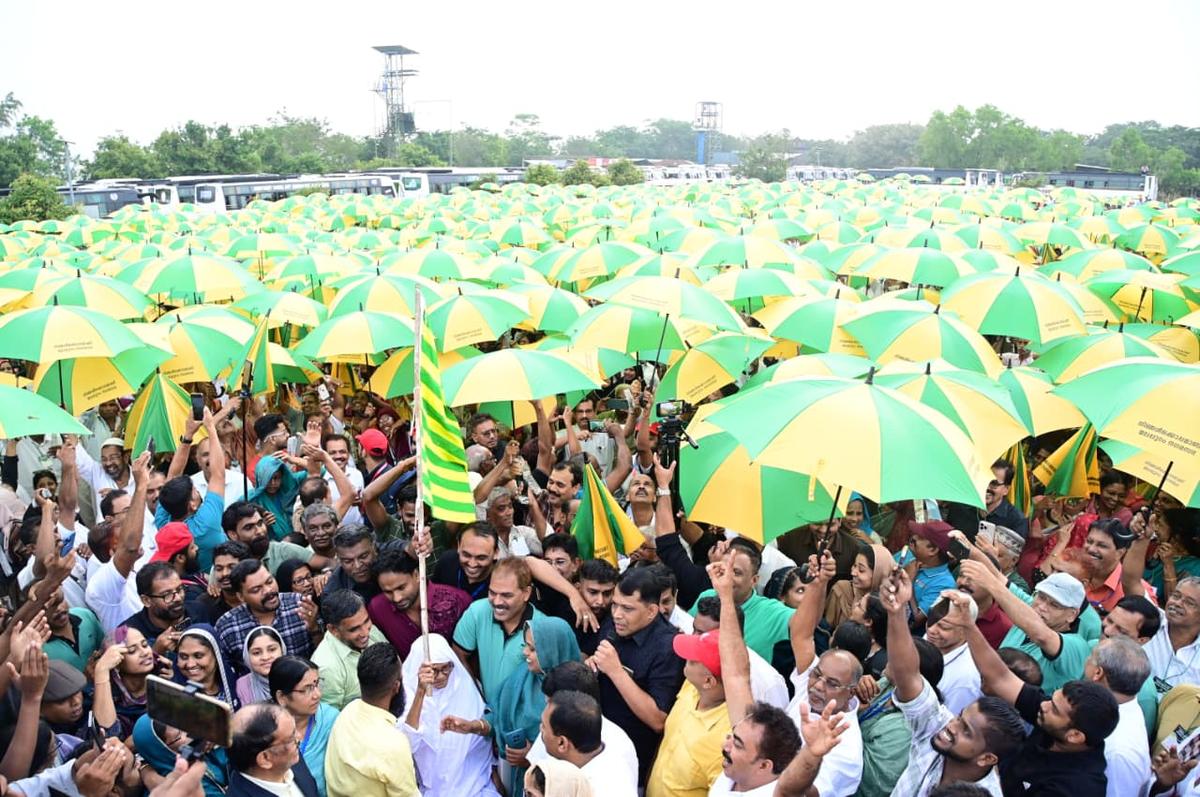 Umbrellas creating a kaleidoscopic canopy of bright green and yellow at Kottakkunnu, Malappuram.