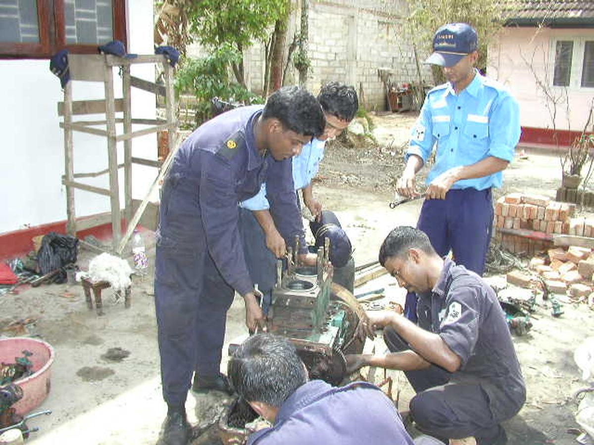 A trawler engine being repaired under the aegis of the Indian Navy in the aftermath of the 2004 tsunami.