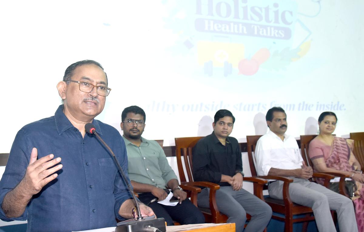 Dr. Jacob P. Alappat speaking at the Holistic Health Talk held at St. Joseph’s College, Devagiri, Kozhikode, on February 24. Dr. Sreeraj K.V., Noufal Basheer, Bobby Jose, and Sherin Thomas are also seen.