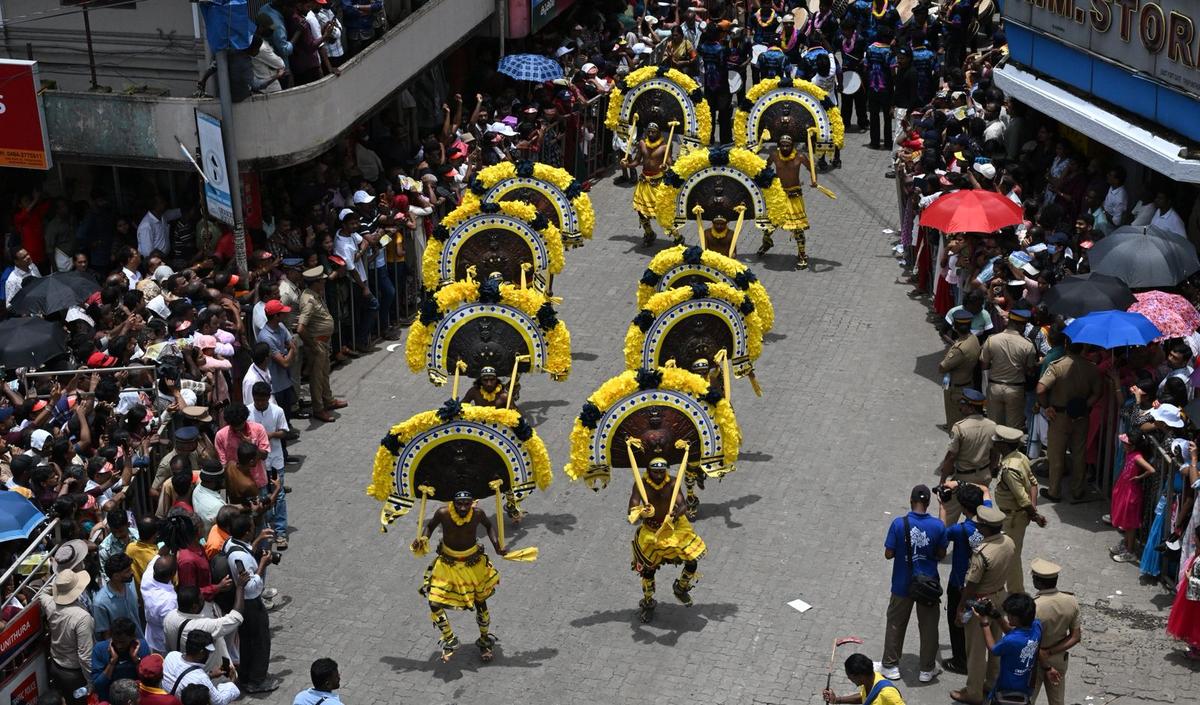 Artistes perform during the ‘Athachamayam’ procession marking the beginning of the annual harvest festival of Onam at Thripunithura in Ernakulam, Kerala, on Tuesday.