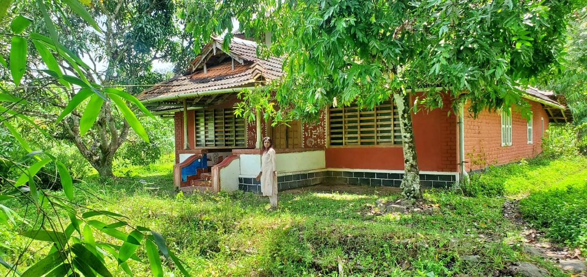   Leela Santhosh in front of Kanavu library building. 