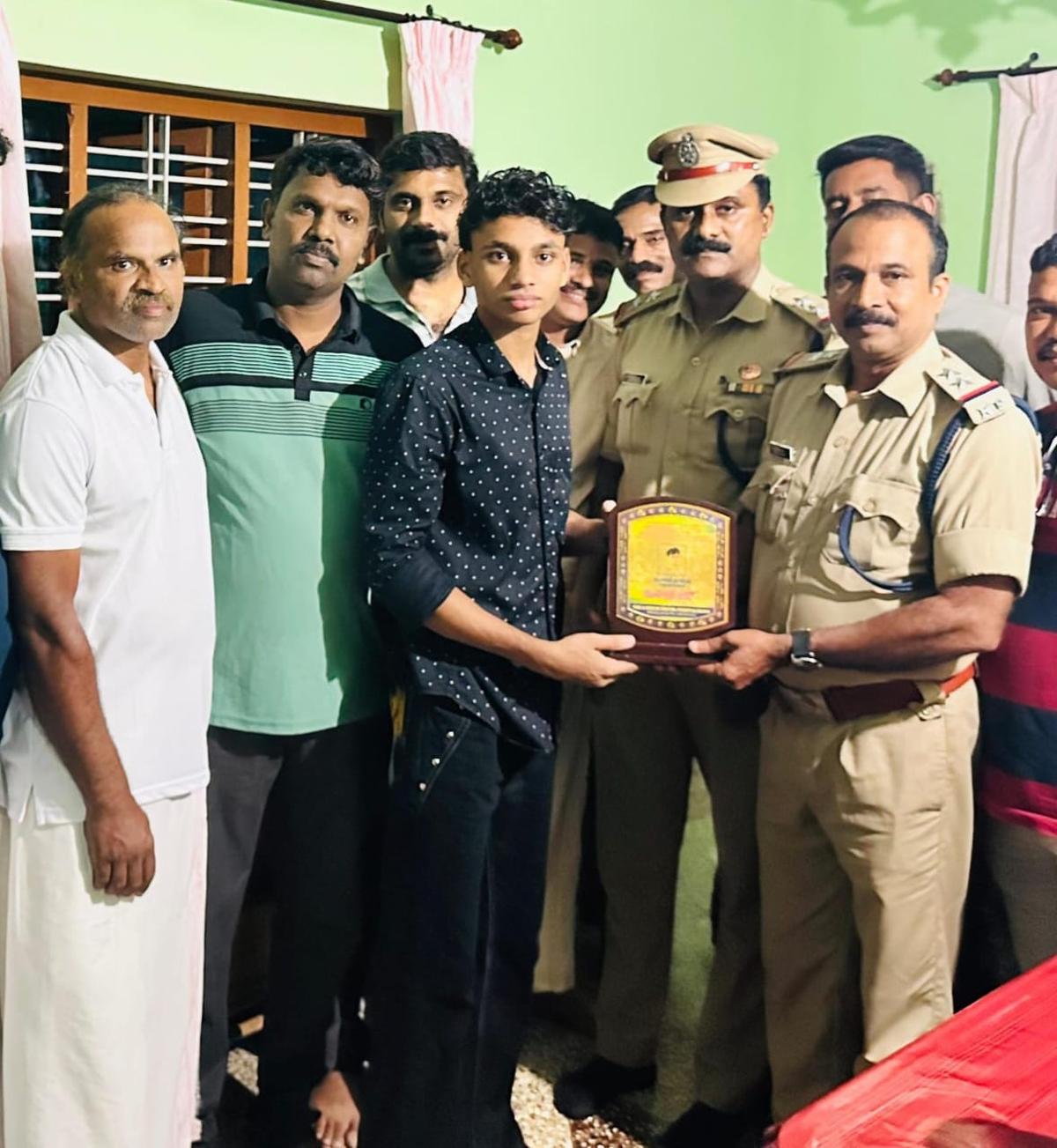 Fire and Rescue Services officers felicitating Mohammed Shamil. Fire and Rescue Services officers felicitating Mohammed Shamil.