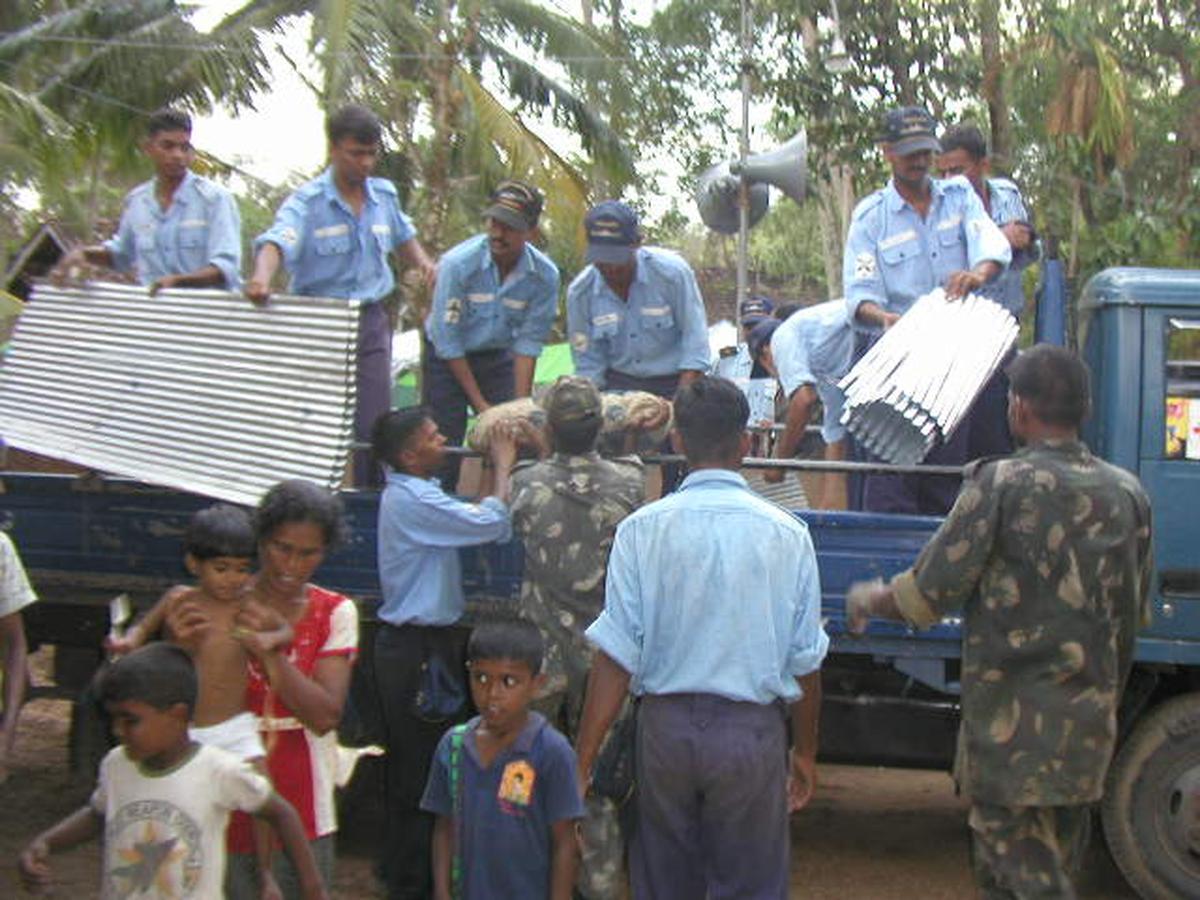 Indian Navy personnel help set up a camp at Kahawa, Galle, in the aftermath of the tsunami in 2004.