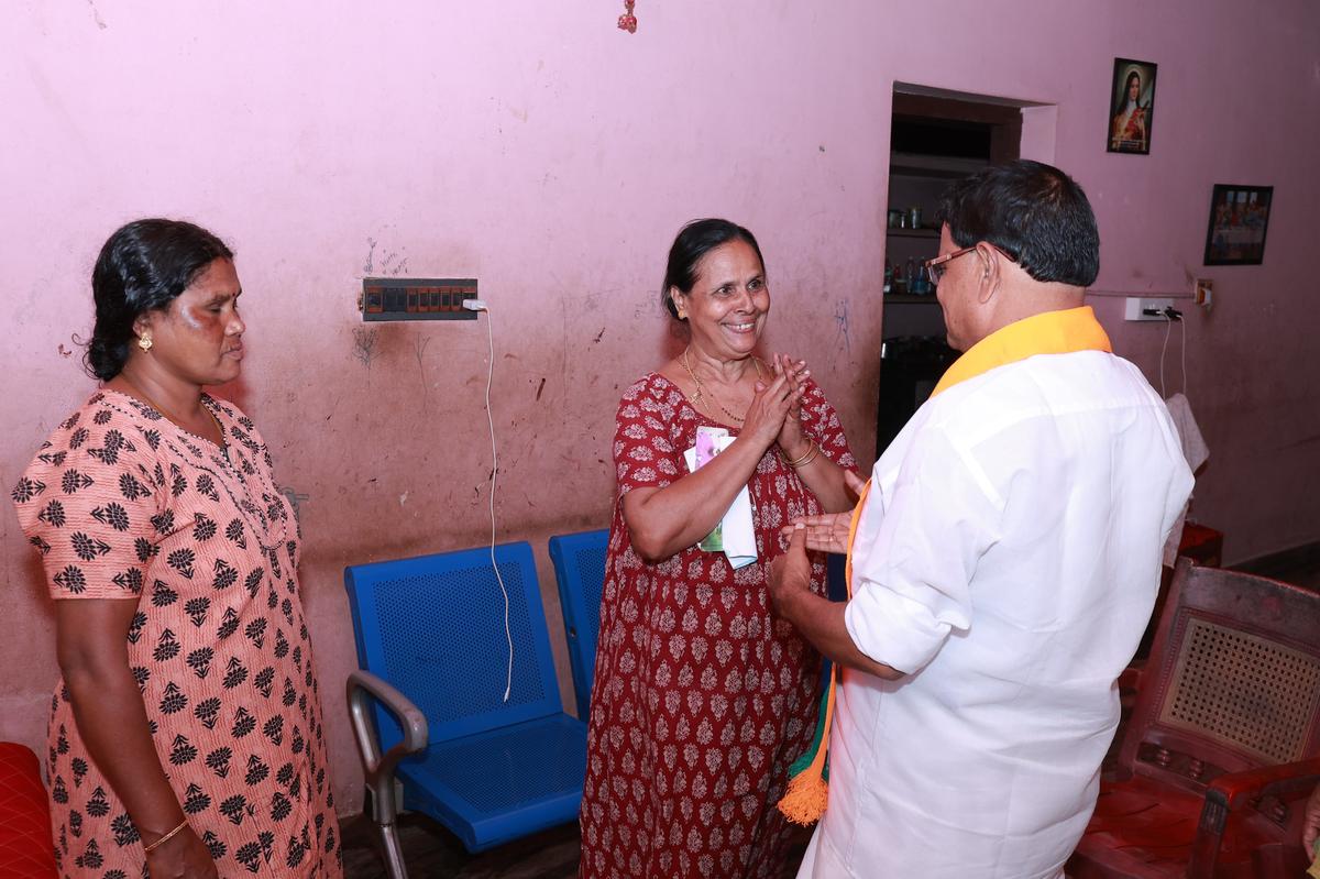 BJP candidate Mohan George requesting vote from a woman at Mukkatta near Nilambur on Tuesday. BJP candidate Mohan George requesting vote from a woman at Mukkatta near Nilambur on Tuesday.