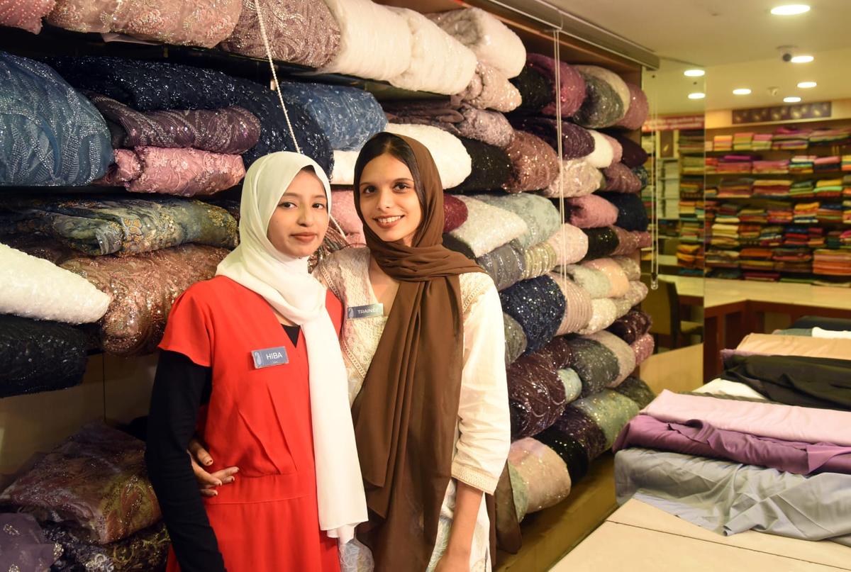 Aviation students Hiba Sherin C.K. and Misbah Sherin work part-time at a textile shop in Kozhikode. Aviation students Hiba Sherin C.K. and Misbah Sherin work part-time at a textile shop in Kozhikode.