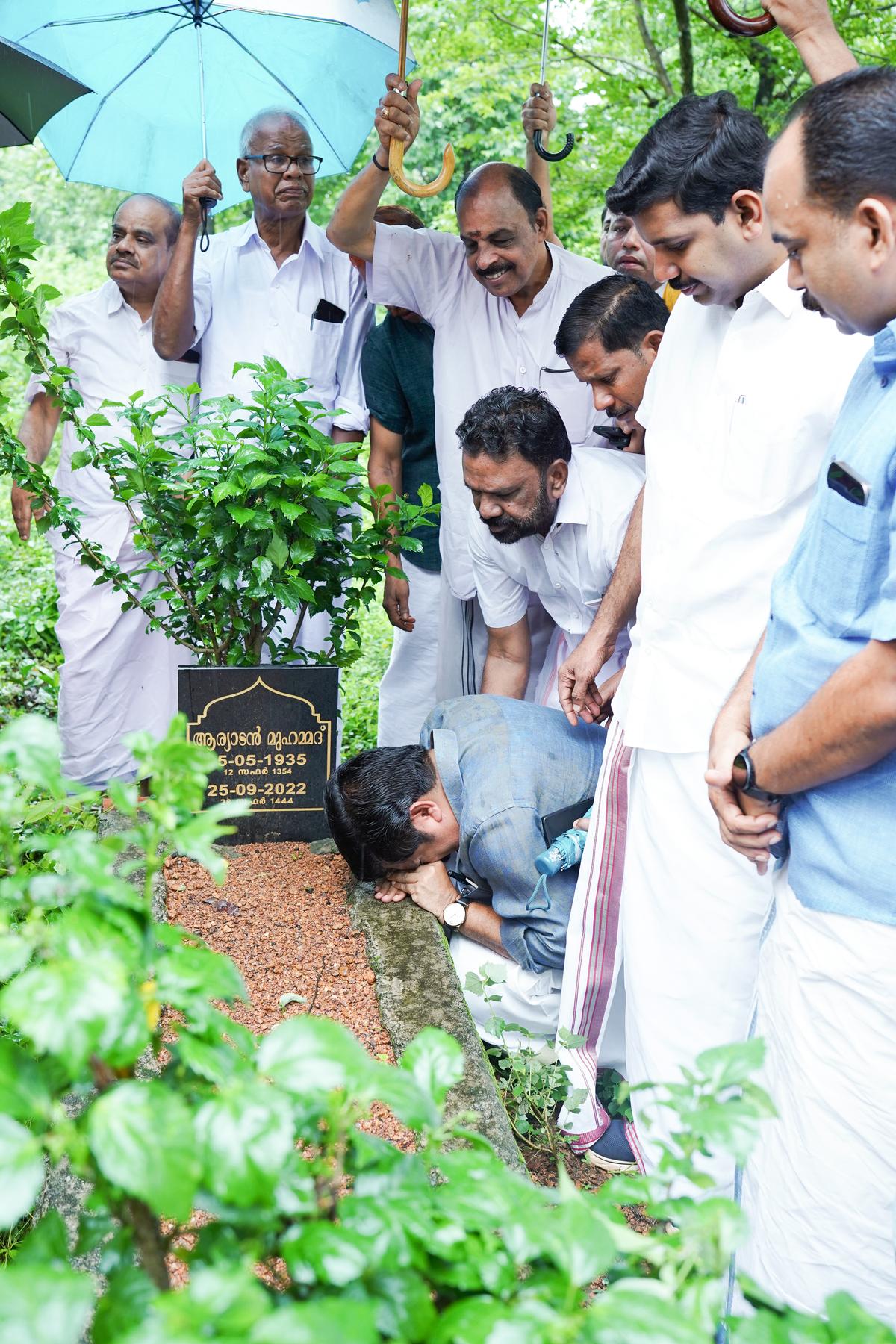 UDF candidate Aryadan Shoukath breaking down at the grave of his father Aryadan Mohammed at Nilambur on Tuesday. UDF candidate Aryadan Shoukath breaking down at the grave of his father Aryadan Mohammed at Nilambur on Tuesday.