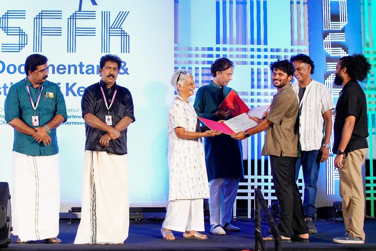 Vishwas K. receiving the Award for Best Short Fiction for Waterman.