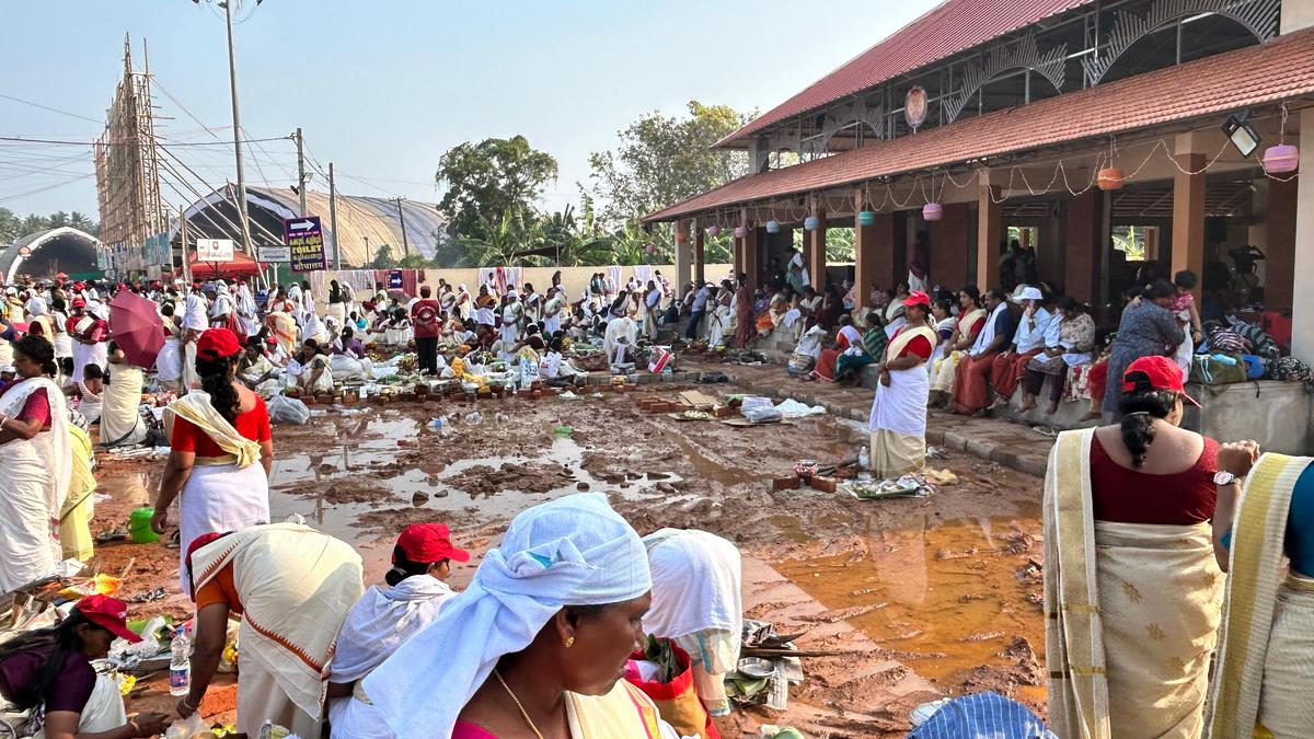 Devotees offering Pongala near the water-logged area on the Attukal Temple premises