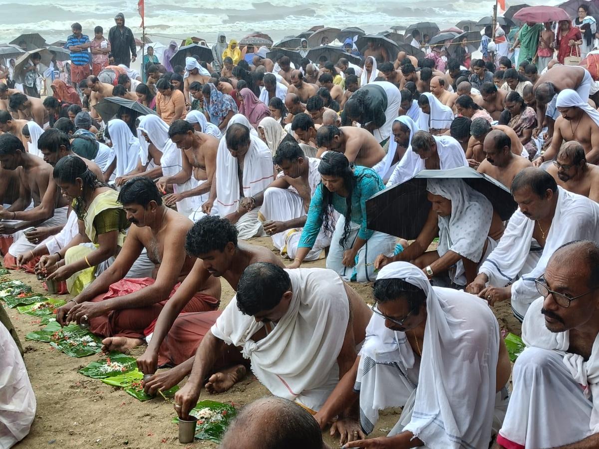 People offering bali tharpanam on the Payyambalam beach in Kannur on Thursday