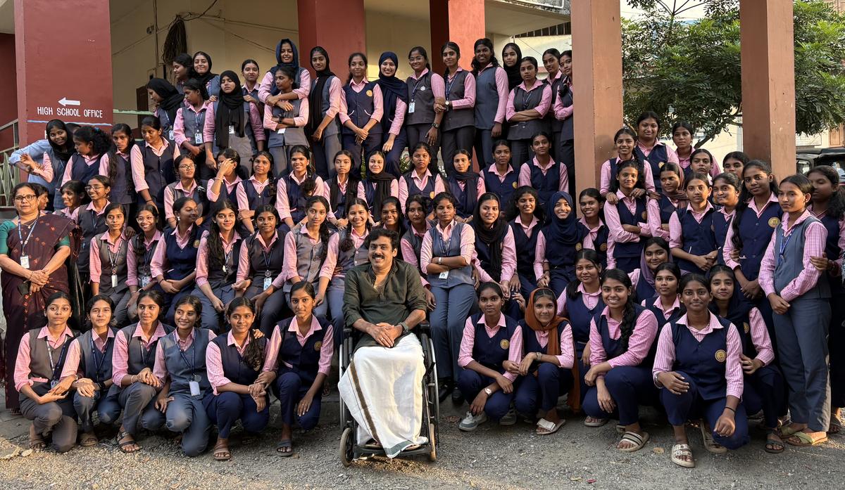NSS volunteers at Government Moyan Model Girls Higher Secondary School, Palakkad, posing for a photo with Ganesh Kailas on Wednesday.