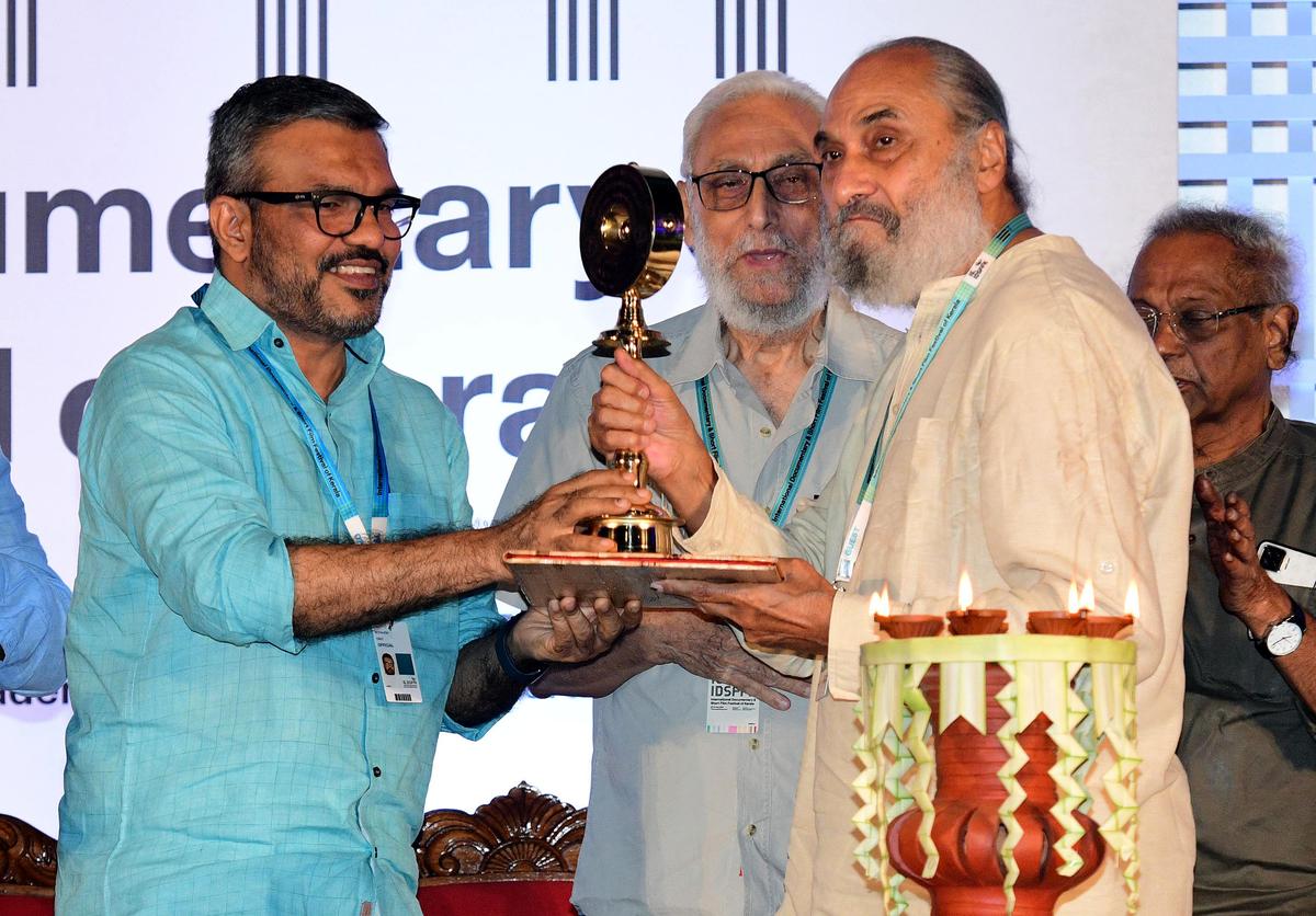 Wildlife filmmakers Naresh Bedi and Rakesh Bedi receive the lifetime achievement award from Minister M.B. Rajesh.