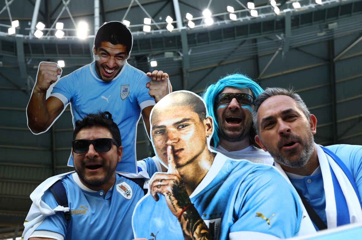 Uruguay fans display cardboard cut-outs of Luis Suarez and Darwin Nunez inside the stadium before the match. 