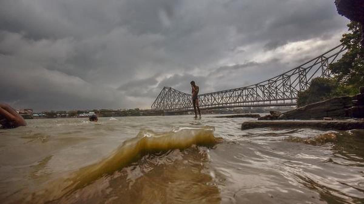 
Storm like weather conditions loom over the Howrah Bridge thanks to Cyclone Yaas, May 24, 2021.