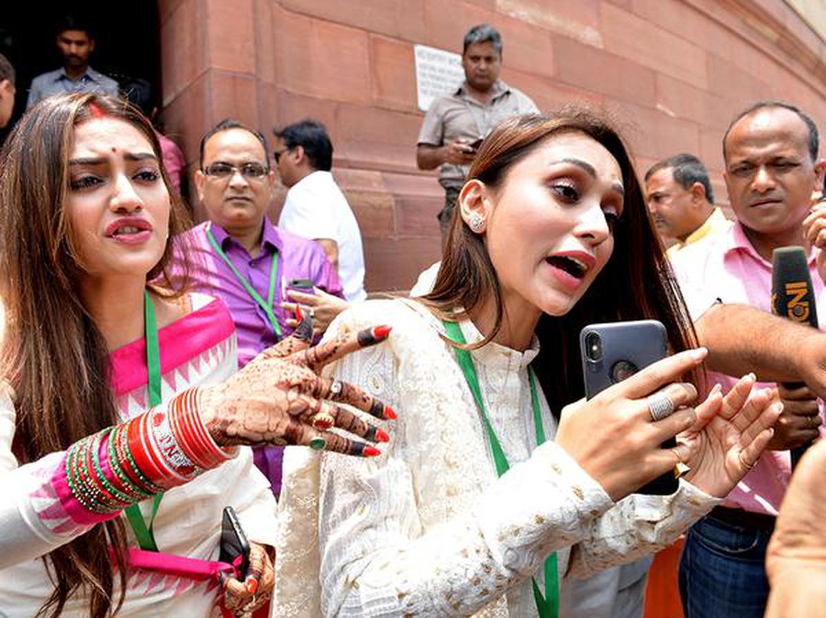 Trinamool Congress MPs Mimi Chakraborty, right, and Nusrat Jahan. File