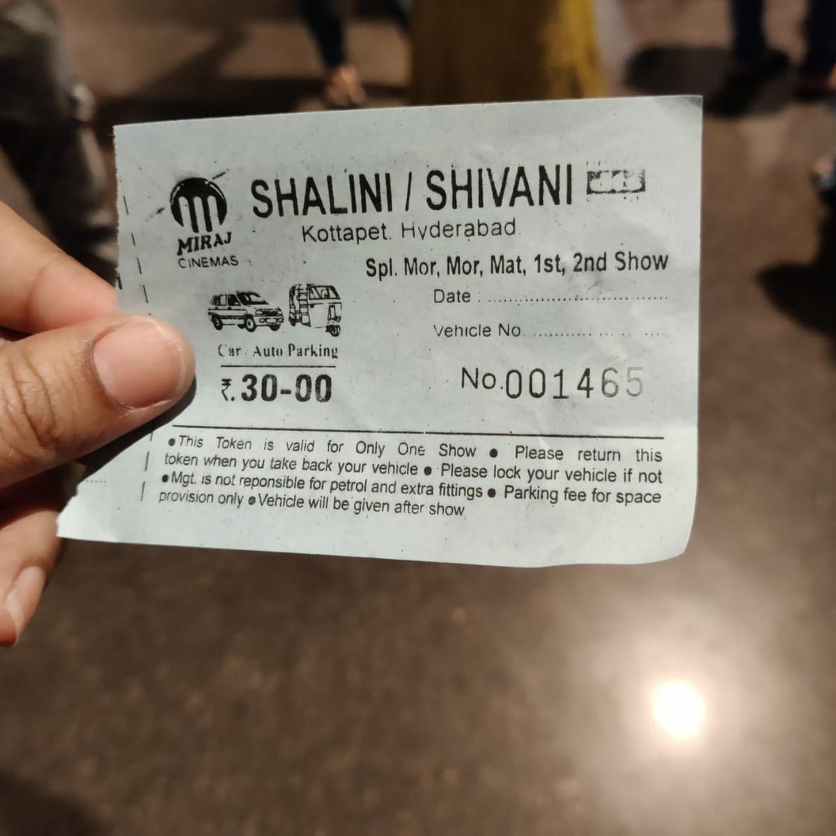 A parking ticket issued by Shalini Cinemas in Hyderabad. 