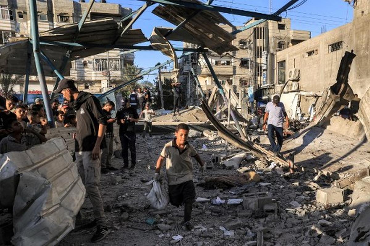Israeli attack kills 16 people at UN school in Gaza as ceasefire talks continue