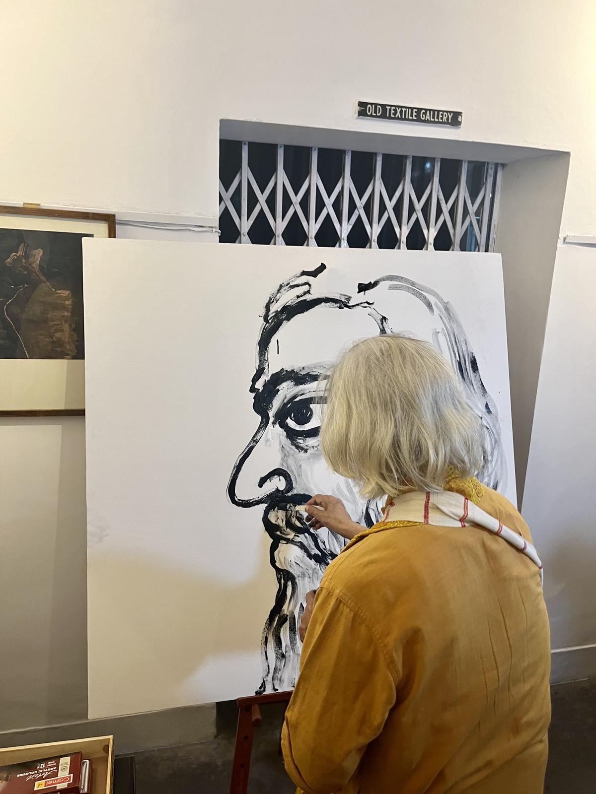 Artist Jogen Chowdhury painting Tagore at the reopening of the Tagore museum at the Academy on Wednesday evening.