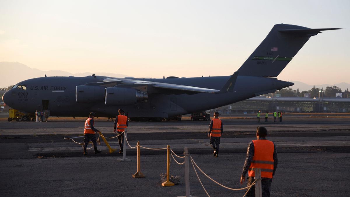 First military flight lands in Guantanamo Bay with migrants deported from the U.S.