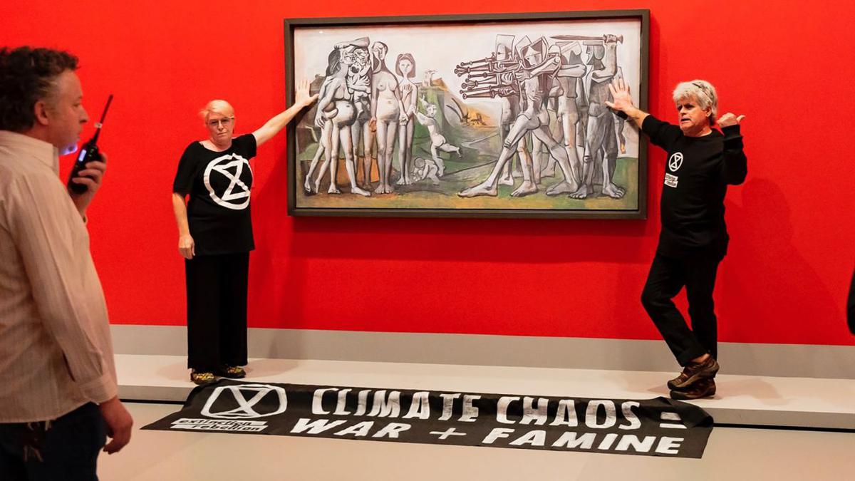 Protesters glue hands to cover of Picasso painting
