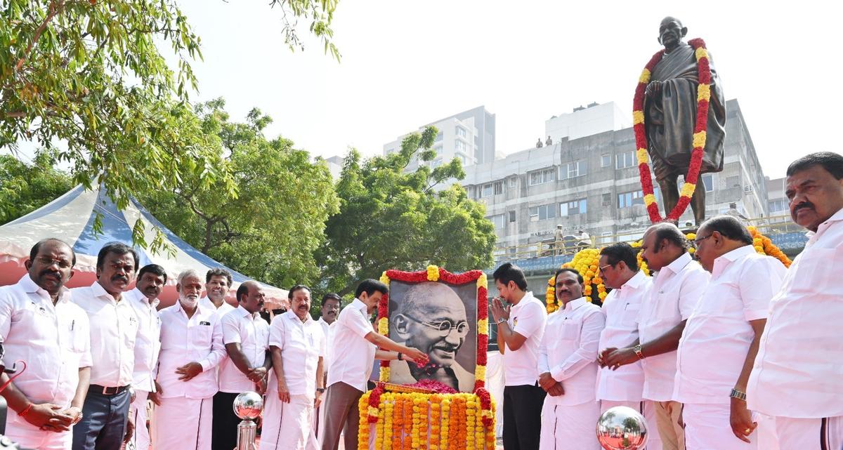 Tamil Nadu Chief Minister M.K. Stalin and Ministers pay floral tributes to a statue of Mahatma Gandhi on the government museum campus in Egmore 