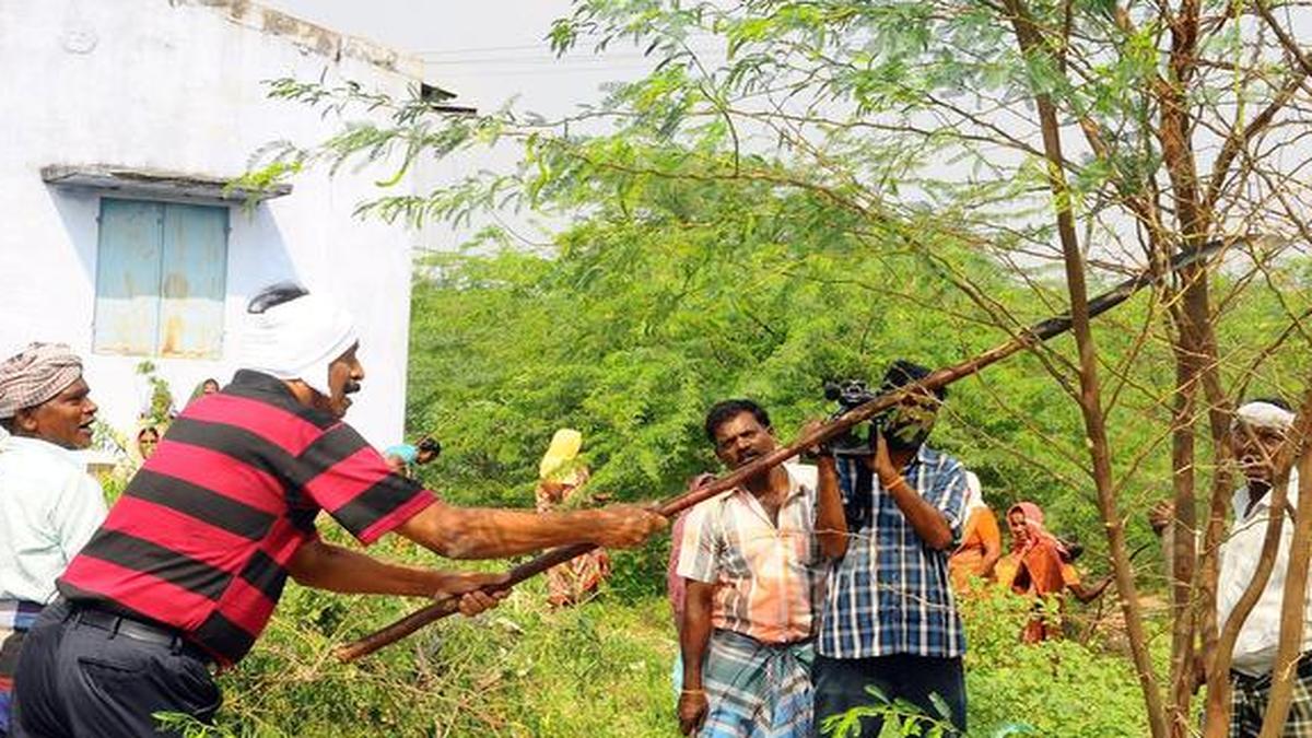 Vaiko joins villagers in uprooting seemai karuvelam trees The Hindu