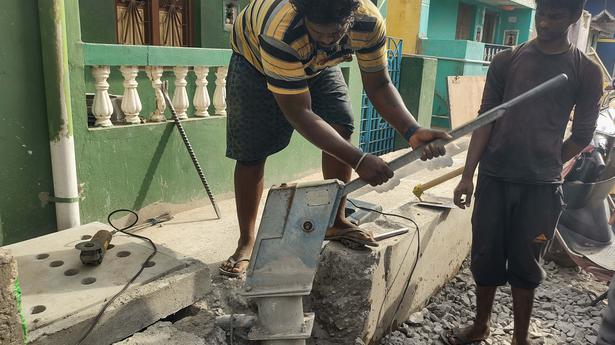 Contractor arrested for laying concrete drain without removing hand pump in Vellore