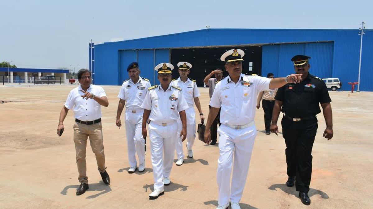 Coast Guard Commander reviews operational preparedness and infrastructure projects