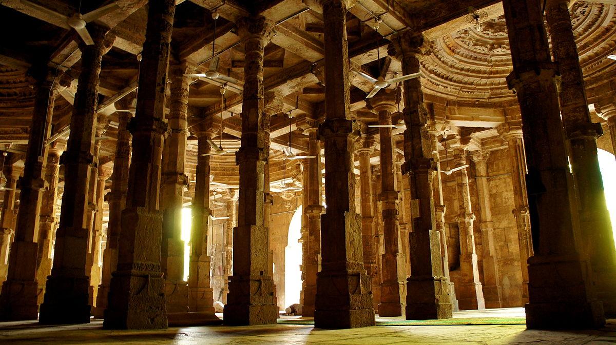 Have you ever entered a mosque where none of the pillars nor minarets are identical? That's the uniqueness of Ahmed Shah's First Royal Mosque. Built in 1414 by Ahmed Shah, it is the oldest mosque in Ahmedabad. It exemplifies the Gujarat style of Indo-Islamic architecture, with its facade featuring carved panels, two minarets on either side, and stone screens adorned with jaali-work to filter sunlight.