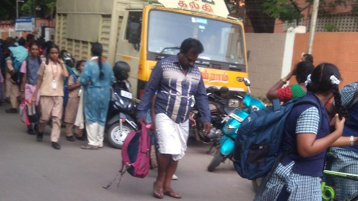 Commercial vehicles parked near school at Ashok Nagar inconvenience students