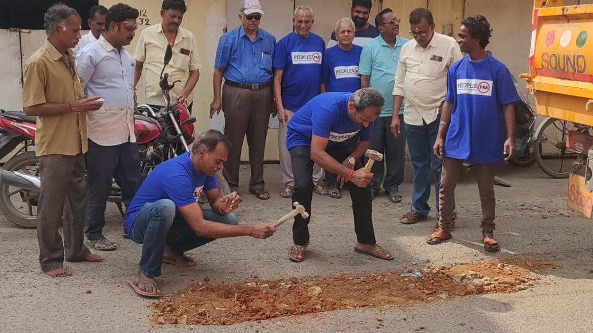 Volunteers celebrate New Year by patching up roads in Chromepet