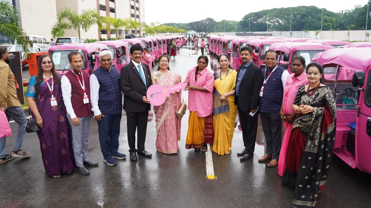 Rotary members handover 100 pink autorickshaws to women
