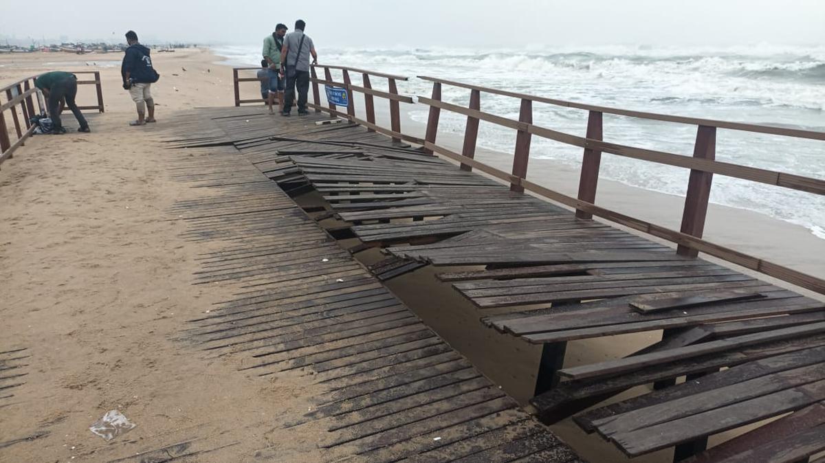 The wooden pathway built at a cost of ₹1.14 crore for the differently-abled to access Marina Beach, that was inaugurated only a fortnight ago has been damaged due to high tides along the coasts in Chennai in view of Cyclone Mandous on December 9, 2022. 