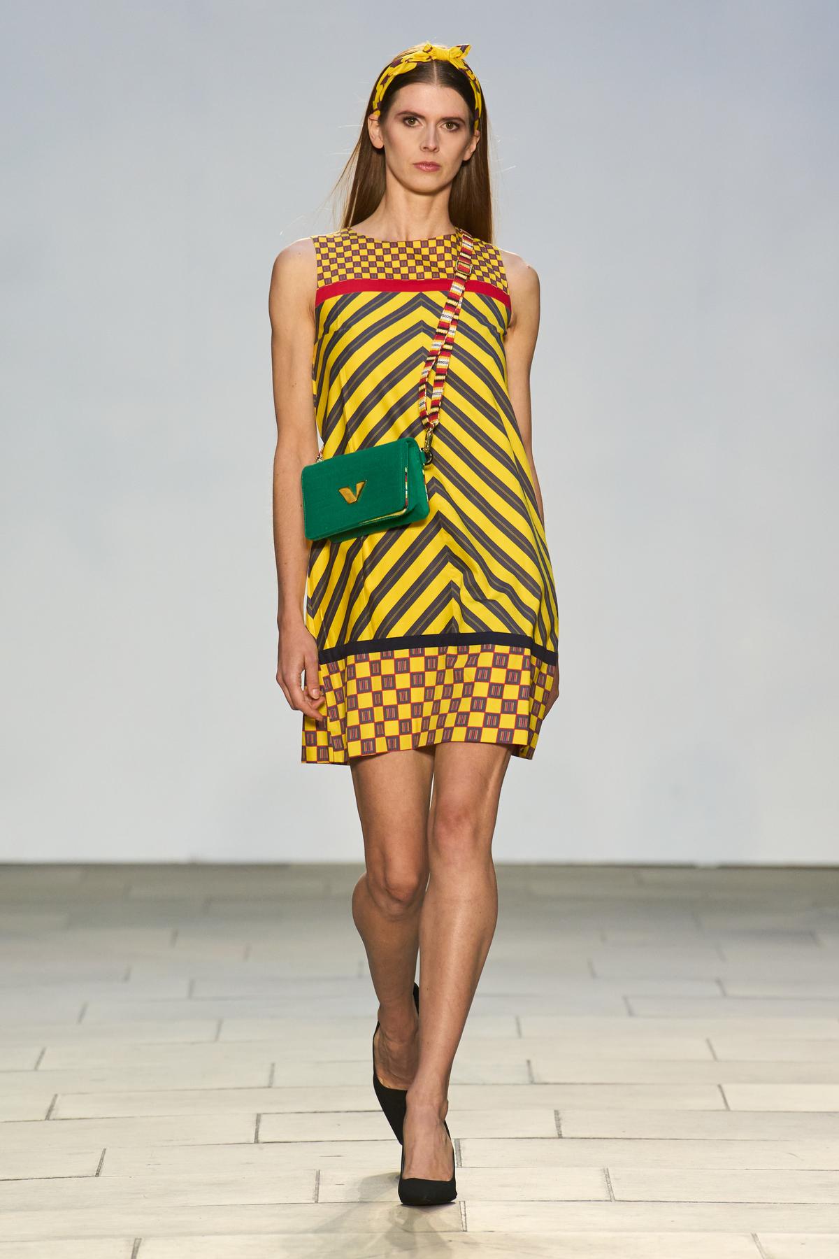 A model walks the ramp with a luxury handbags A model walks the ramp with a luxury handbags