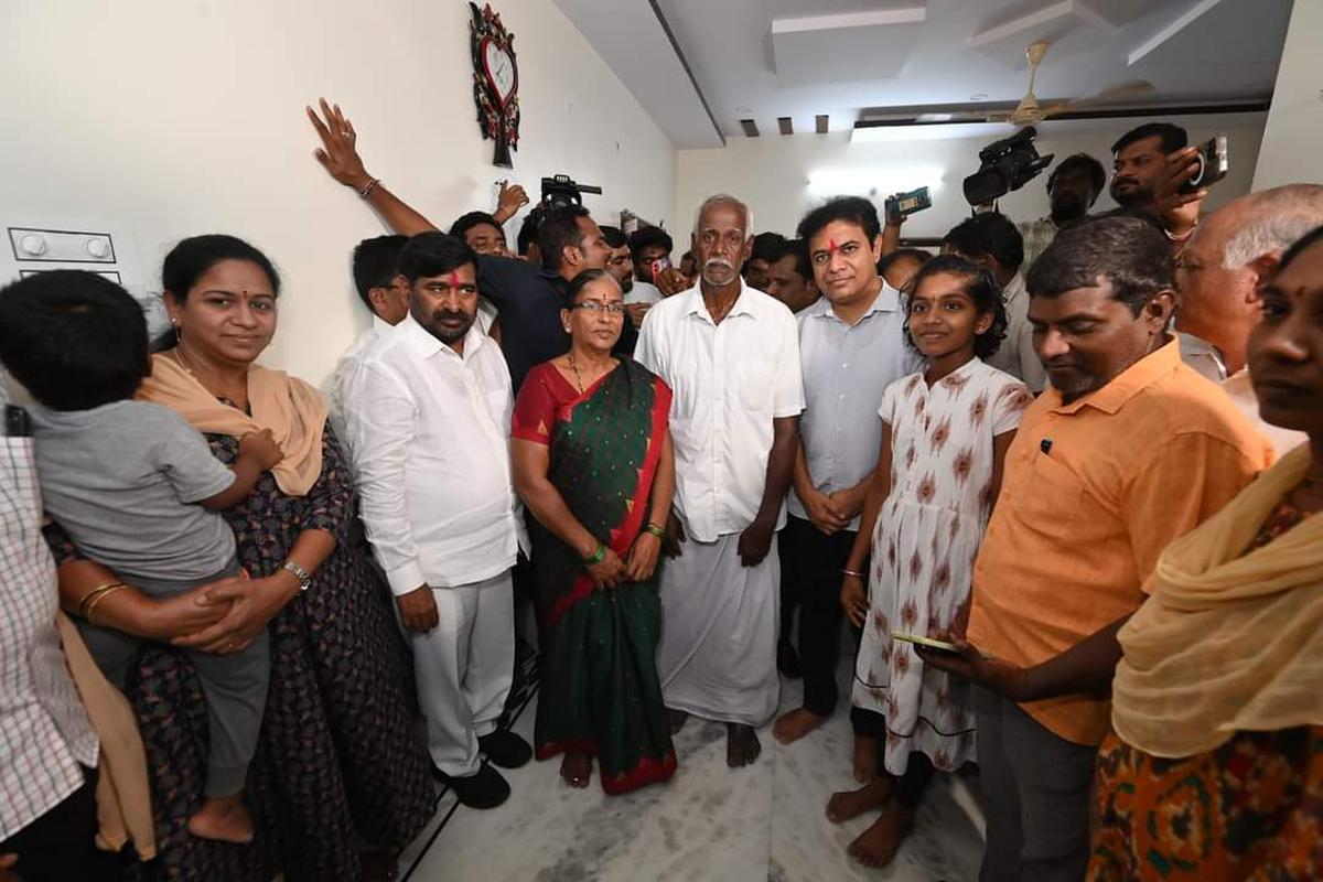 BRS working president K.T. Rama Rao and other party leaders with Borla Ram Reddy and his family at Mushampalli in Nalgonda district on Monday.