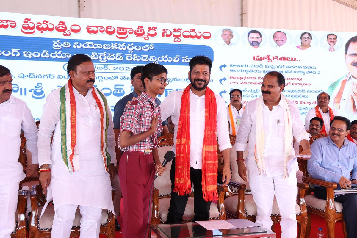 Telangana Chief Minister A. Revanth Reddy with a student from residential school.