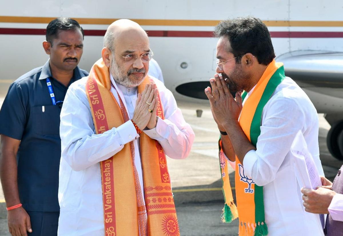 Union Home Minister Amit Shah being received by BJP State president G. Kishan Reddy on his arrival in Hyderabad to address election rallies in Telangana on Saturday.