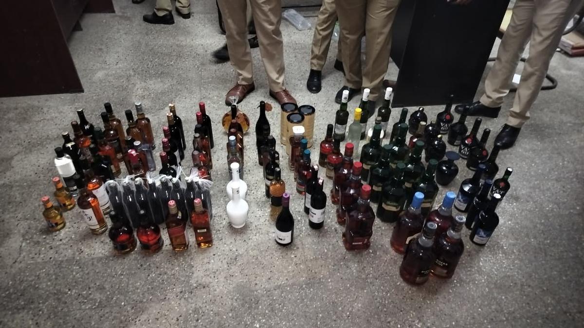 127 liquor bottles seized near airport, two cases registered