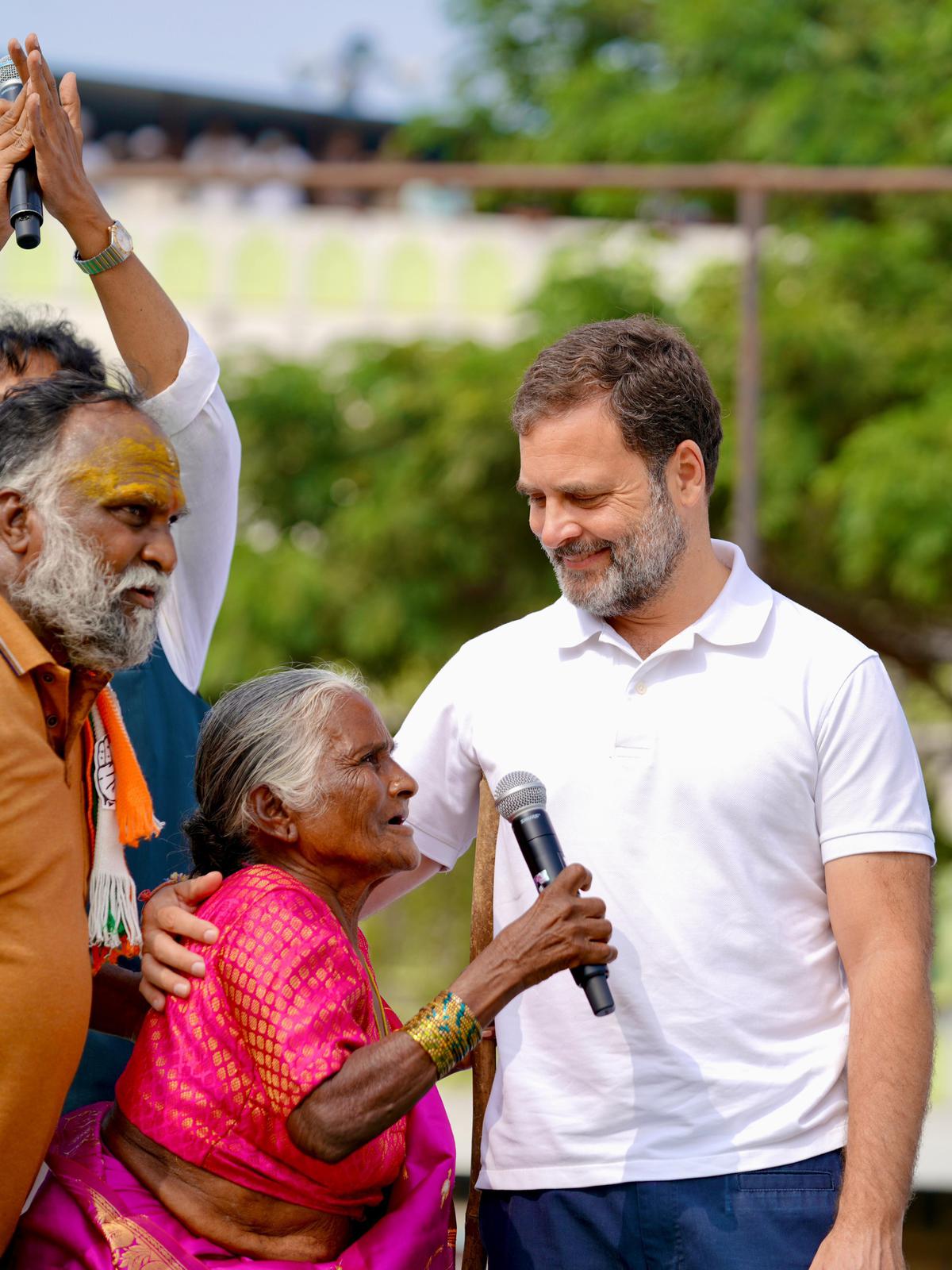 Congress leader Rahul Gandhi speaks to an elderly woman at a public meeting in Sangareddy on November 26. Sangareddy MLA T. Jayaprakash Reddy is also seen. 