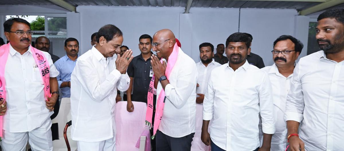 BRS president K. Chandrasekhar Rao and former IPS officer R.S. Praveen Kumar exchanging greetings after the latter joined the regional party on Monday.