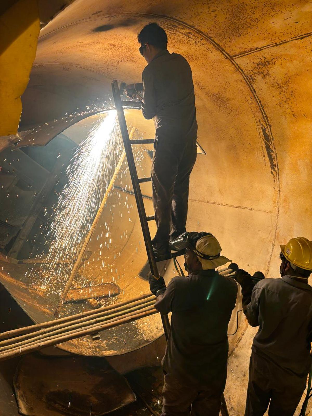 SCR’s Divisional Mechanical Engineering team using plasma cutters to clear the damaged the Tunnel Boring Machine inside SLBC.