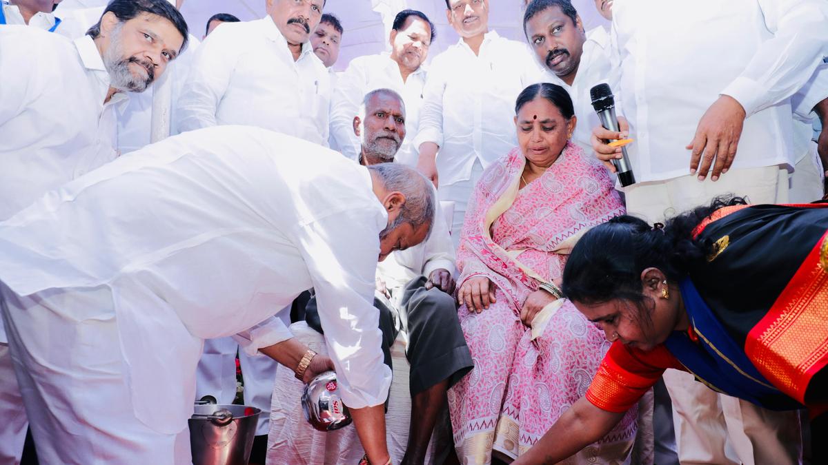 Damodar Rajnarsimha washes feet of  Madiga martyrs’ family members