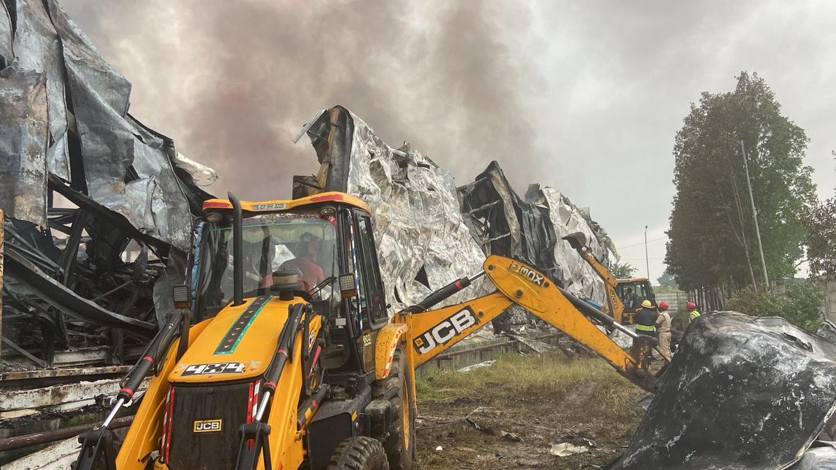 Earthmover working through the debris at the facility. Earthmover working through the debris at the facility.