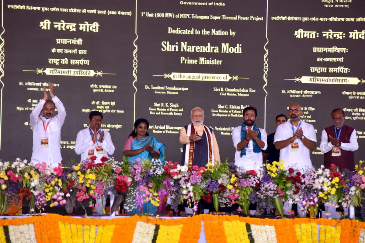 Prime Minister Narendra Modi pressing the button to launch developmental works in Telangana from Nizamabad virtually on Tuesday